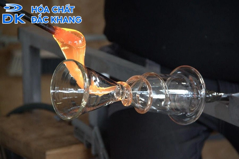 A glass being poured into a glassDescription automatically generated
